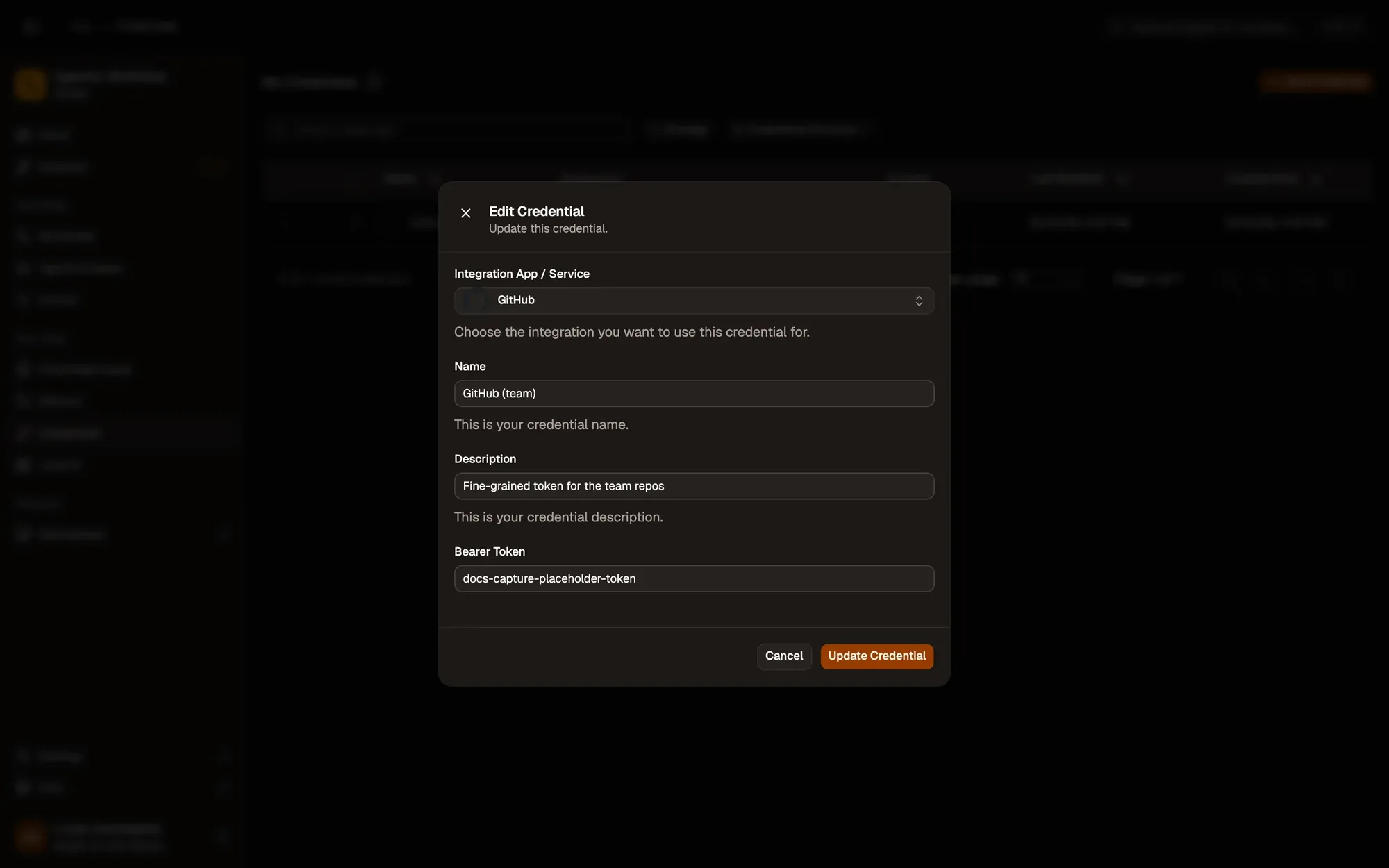 The Edit Credential dialog for a GitHub credential named GitHub (team): the Integration App / Service set to GitHub, the Name and Description fields, the Bearer Token field (a placeholder value), and Cancel and Update Credential buttons.